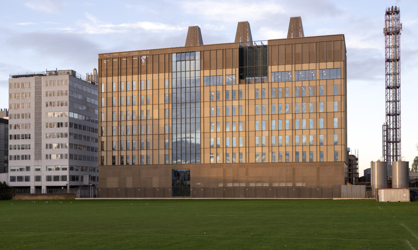 The MRC Laboratory of Medical Sciences building seen across the playing fields